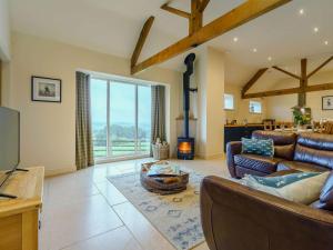 a living room with a couch and a fireplace at 4 Bed in Durham 89858 in Willington