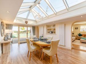 a conservatory dining room with a table and chairs at 2 Bed in Rowlands Gill 89758 in Stanley