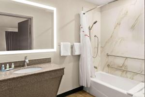 A bathroom at Quality Inn & Suites