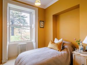 a bedroom with a bed and a window at 2 Bed in Cairngorms 89716 in Inverurie