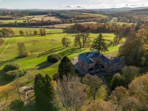 an aerial view of a house in a field at 2 Bed in Cairngorms 89716 in Inverurie