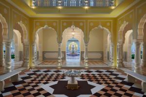 a large room with a checkerboard floor and a fountain at Hyatt Regency Jaipur Mansarovar in Jaipur