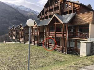 a building with a red circle in front of it at Appartement Valloire 6-8 pers in Valloire