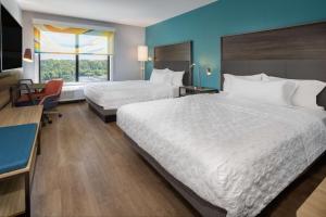 a hotel room with two beds and a window at Tru By Hilton Pensacola Airport Medical Center in Pensacola +31 photos