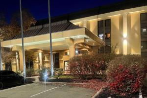 a building with a car parked in front of it at Days Inn by Wyndham Englewood Dayton Airport in Dayton