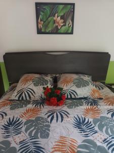 a bed with a bouquet of flowers on it at Lovely FLowers in Mount Lavinia in Mount Lavinia