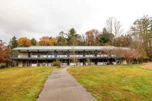 a large building with a path in front of it at Waynesville Inn and Golf Club, Tapestry Collection by Hilton in Waynesville