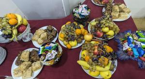 a bunch of plates of food on a table at Dkd-bridge Hotel in Tbilisi City