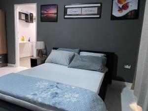 מיטה או מיטות בחדר ב-EL HOGAR