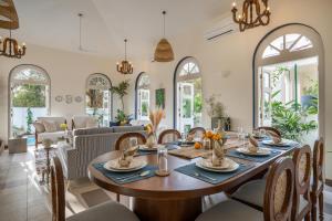 a dining room with a table and chairs at LohonoStays Aurelia Villa D in Vagator
