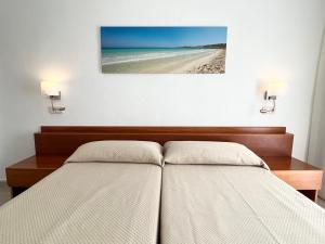 Ein Bett oder Betten in einem Zimmer der Unterkunft Aparthotel Ciudad Laurel