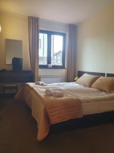 Letto o letti in una camera di Apartment ZAX B7 in Terra Complex