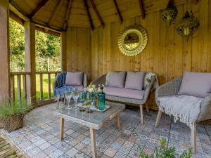 a patio with two couches and a table at 1 Bed in Newchurch 89932 in Newchurch