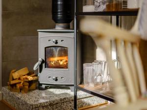 a stove in a kitchen with a fire in it at 1 Bed in Newchurch 89932 in Newchurch