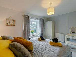 a bedroom with a large bed and a window at 1 Bed in Saltash 89873 in Pillaton
