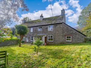 an old stone house on a grassy field at 1 Bed in Saltash 89873 in Pillaton