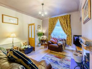 a living room with a couch and a chair at 1 bed property in Haworth 89955 in Oxenhope