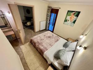 A bed or beds in a room at Queen of Orliaka