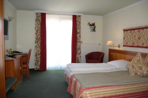 Katil atau katil-katil dalam bilik di Hotel Ochsen Stuttgart