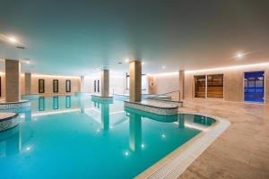 a large swimming pool in a hotel room at The Celtic Royal Hotel in Caernarfon