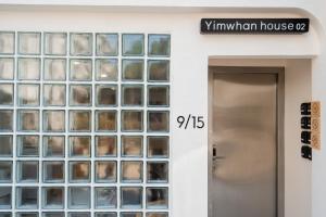 a door to a building with glass windows at Yimwhan House 02, Ayutthaya old town in Phra Nakhon Si Ayutthaya