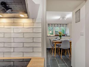 a kitchen and dining room with a table and chairs at 2 Bed in Keswick 90064 in Threlkeld