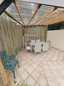 a patio with a table and chairs on it at 39 HOOG STREET in Polokwane