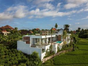 an aerial view of a house with a garden at NEW Luxury 3BR, Jacuzzi Rooftop Rice Field, Staff in Legian