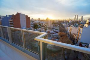 a view of a city from the balcony of a building at Byblos Palermo Soho in Buenos Aires