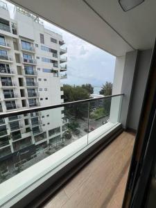 a balcony with a large window in a building at Luxurious 3-Bedroom in Hulhumalé in Hulhumale