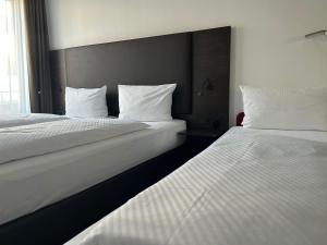 Voodi või voodid majutusasutuse Hotel Fackelmann toas
