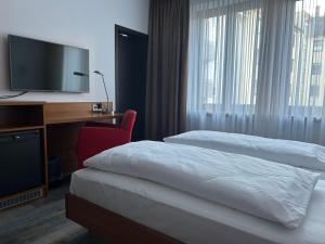 Voodi või voodid majutusasutuse Hotel Fackelmann toas