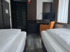 Voodi või voodid majutusasutuse Hotel Fackelmann toas