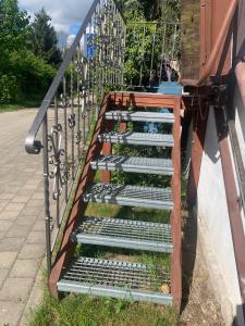 a row of stairs with plants in them at Ferienwohnung Puttenusenhof in Klausdorf Brandenburg