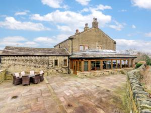 an external view of a house with a patio at 3 Bed in Halifax 90209 in Sowerby Bridge