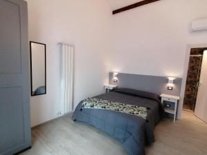 Tempat tidur dalam kamar di Hotel Del Borgo