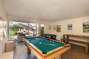 a billiard room with a pool table at Bodensee Hotel Storchen in Uhldingen-Mühlhofen