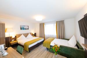 Postel nebo postele na pokoji v ubytování Hotel Alfa