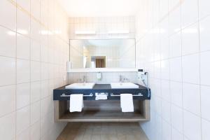 Ένα ή περισσότερα κρεβάτια σε δωμάτιο στο Hotel Alfa