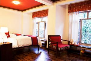 Voodi või voodid majutusasutuse Shambaling Boutique Hotel toas