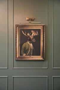 a painting of a deer head on a door at The Portico Hotel in London