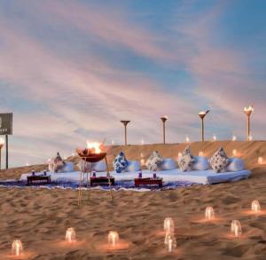 a rendering of a beach with lights in the sand at ARMAN DESERT RESORT in Sām