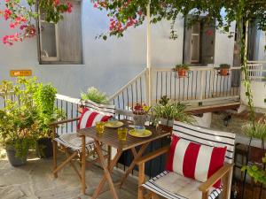 a wooden table and chairs on a patio at Stratos ArtDeco House in Kalavasos