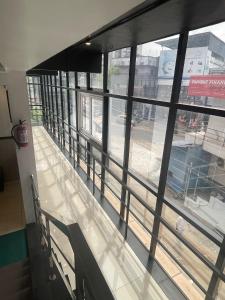 a building with a view of a street from a window at ABUDHABI RESIDENCY in Palakkad
