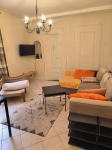 a living room with a couch and a table at B Appartement in Malakoff