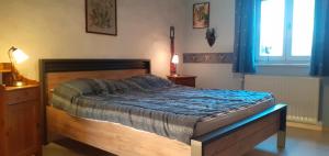 Postel nebo postele na pokoji v ubytování l'Heure bleue