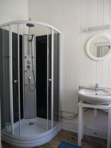 a bathroom with a glass shower and a sink at Maison de 4 chambres dans les Pyrénées in Cierp