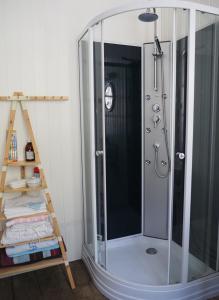 a shower with a glass enclosure in a bathroom at Maison de 4 chambres dans les Pyrénées in Cierp