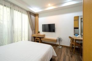 TV a/nebo společenská místnost v ubytování Studio-Vincent Apartment HaNoi