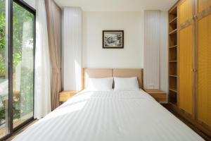 Postel nebo postele na pokoji v ubytování Studio-Vincent Apartment HaNoi